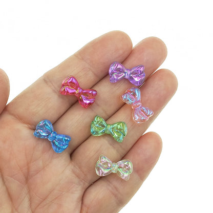 mano cuentas lazo cinta tornasol colores